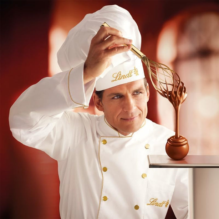 Detalle de bombones y diseño del calendario Lindt Ciudad Navideña.