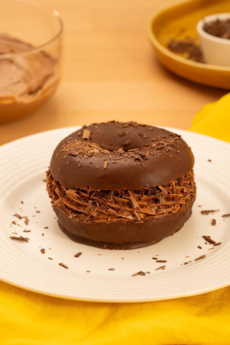 Donuts Bombón, el capricho más irresistible, Pack de 6 unidades. Disfruta de la tierna masa de Donuts de siempre, ahora recubierta con una crujiente y deliciosa capa de chocolate. Bimbo - ingredientes