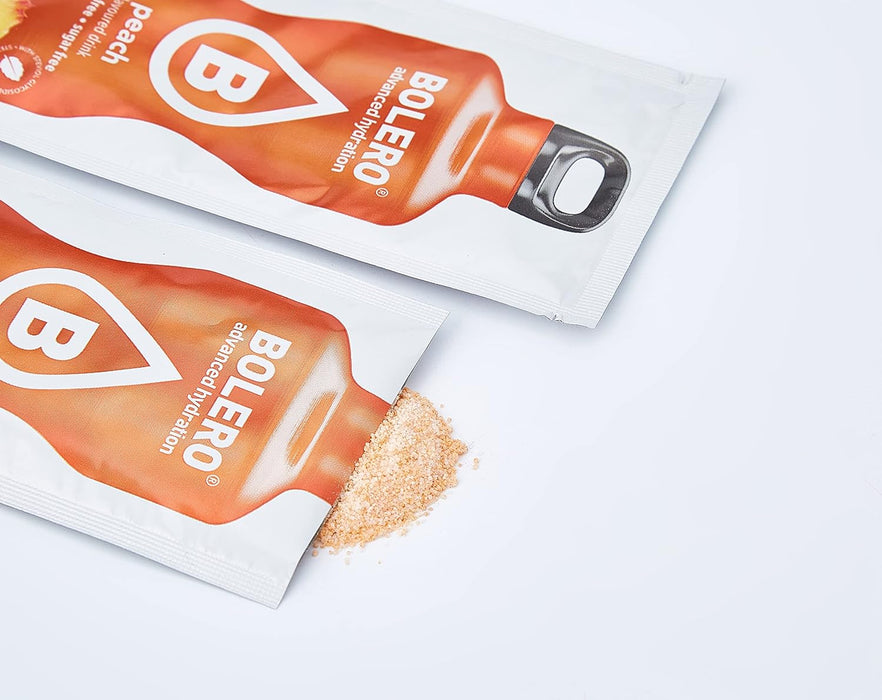 Bolero Bebida Instantánea Sabor Melocotón, Caja de 12x9g. Preparado en polvo sin azúcar con Stevia y Vitamina C para una hidratación saludable, baja en calorías y llena de sabor. Bolero - detalle