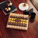 Ferrero Collection, Surtido de 48 Bombones Premium (518g). Descubre una selección irresistible con el clásico Ferrero Rocher, el exótico Raffaello y el intenso Rondnoir. Ferrero Rocher - detalle