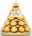 Ferrero Rocher Pirámide de Navidad, 28 Bombones (350g). Un centro de mesa espectacular con el icónico bombón de chocolate y avellanas, perfecto para decorar y compartir en tus fiestas. Ferrero Rocher - frontal