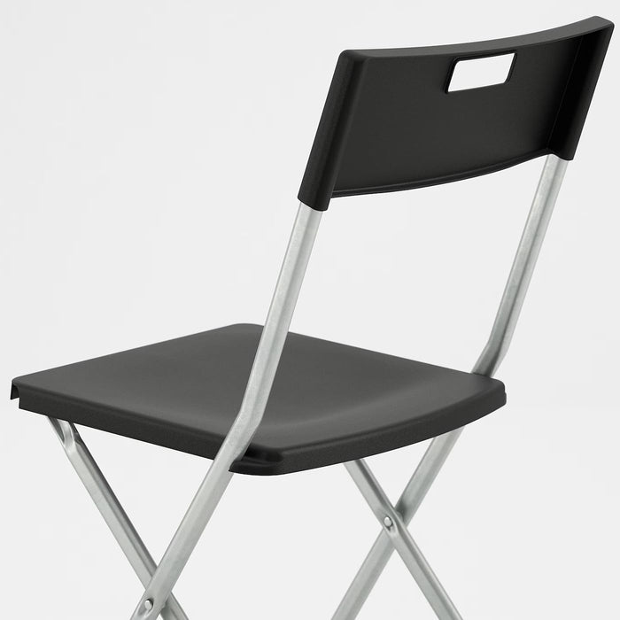 Ikea GUNDE Silla Plegable, Negro. La solución perfecta y económica para tener asientos extra. Ligera, resistente y fácil de guardar, es ideal para visitas, eventos y espacios pequeños. Ikea - ingredientes