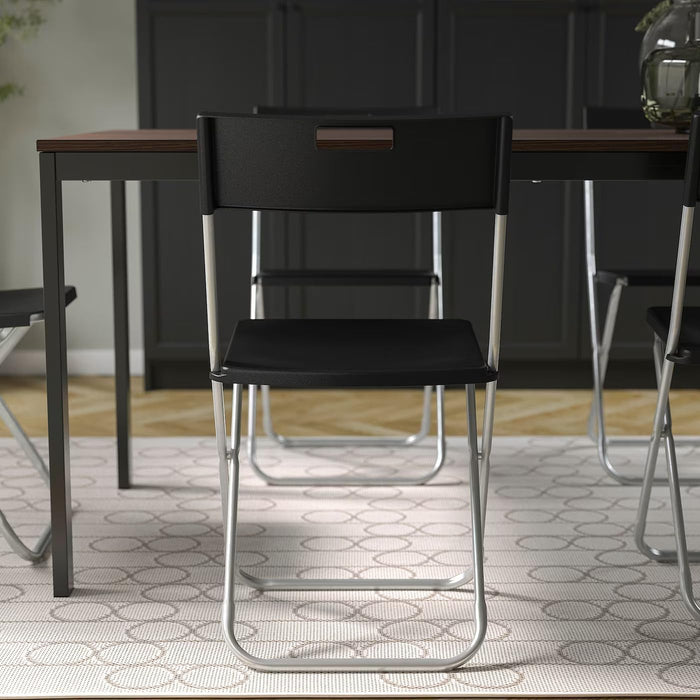 Ikea GUNDE Silla Plegable, Negro. La solución perfecta y económica para tener asientos extra. Ligera, resistente y fácil de guardar, es ideal para visitas, eventos y espacios pequeños. Ikea - presentacion
