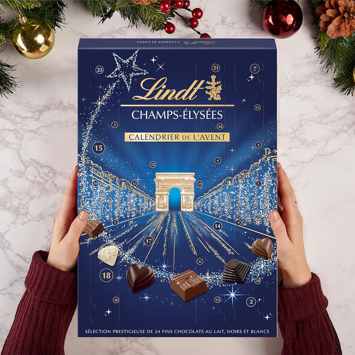 Calendario de Adviento Lindt Champs-Élysées, 250g de un exquisito surtido de bombones de chocolate con leche, negro y blanco. La cuenta atrás más sofisticada para Navidad. Lindt - lateral