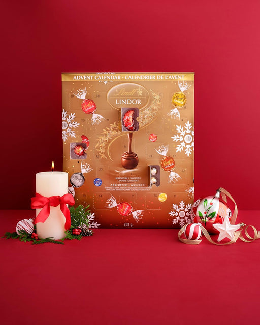 Calendario de Adviento Lindt LINDOR con 300g de bombones surtidos. Un viaje de sabor con 24 sorpresas de chocolate con leche, negro, blanco, avellana, fresa y coco. Lindt - pack