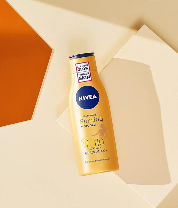 NIVEA Q10 Loción Corporal Reafirmante y Autobronceadora, 400ml. Consigue una piel visiblemente más firme en 10 días y un bronceado natural y gradual con esta loción 2 en 1. Nivea - detalle