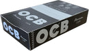 OCB Premium 1 1/4, Pack de 25 Librillos de Papel de Fumar. El papel de liar negro más icónico en un formato práctico, con 50 hojas ultrafinas por librillo para una combustión lenta. Ocb - frontal