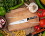 Quttin Cuchillo Cocinero Profesional Sybarite, Hoja de 25 cm. Forjado en acero inoxidable con Molibdeno Vanadio y mango ergonómico de POM con remaches. Quttin - ingredientes