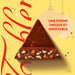 Calendario de Adviento Toblerone con 200g de chocolate suizo. Incluye una deliciosa selección de mini chocolatinas con miel y almendras para una Navidad triangularmente perfecta. Toblerone - ingredientes
