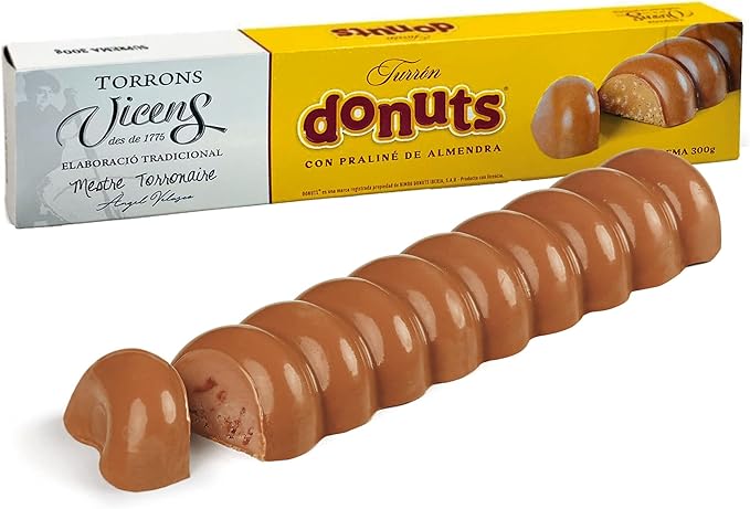 Turrón de Donuts Torrons Vicens, 300 grs. Innovador turrón con praliné de almendras y el auténtico sabor de los Donuts, elaborado por el maestro turronero Ángel Velasco. Torrons Vicens - frontal